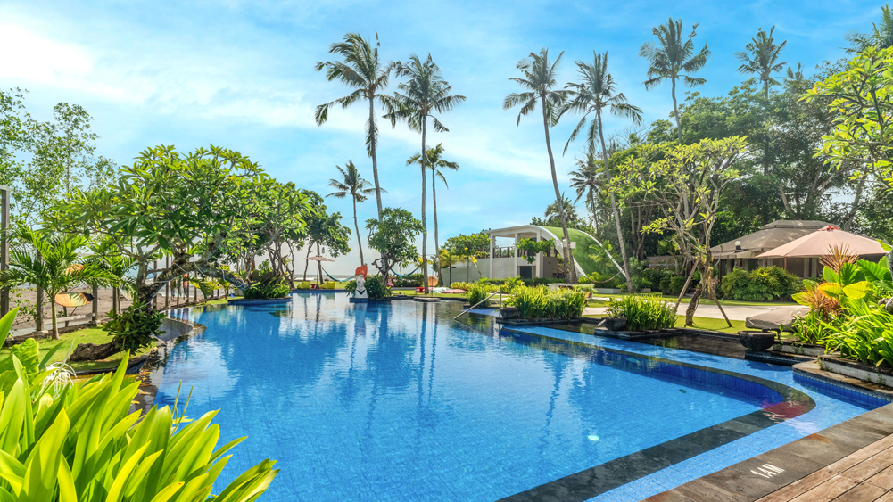 Elite Havens - Kiss Bali Beach Residence - Bali -  Indonesia - Expansive pool and lawn area